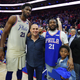 Joel Embiid, No. 21 of the Philadelphia 76ers; 76ers co-owner Michael Rubin; and Meek Mill and his son Papi after the game against the Miami Heat at Wells Fargo Center on April 24, 2018, in Philadelphia